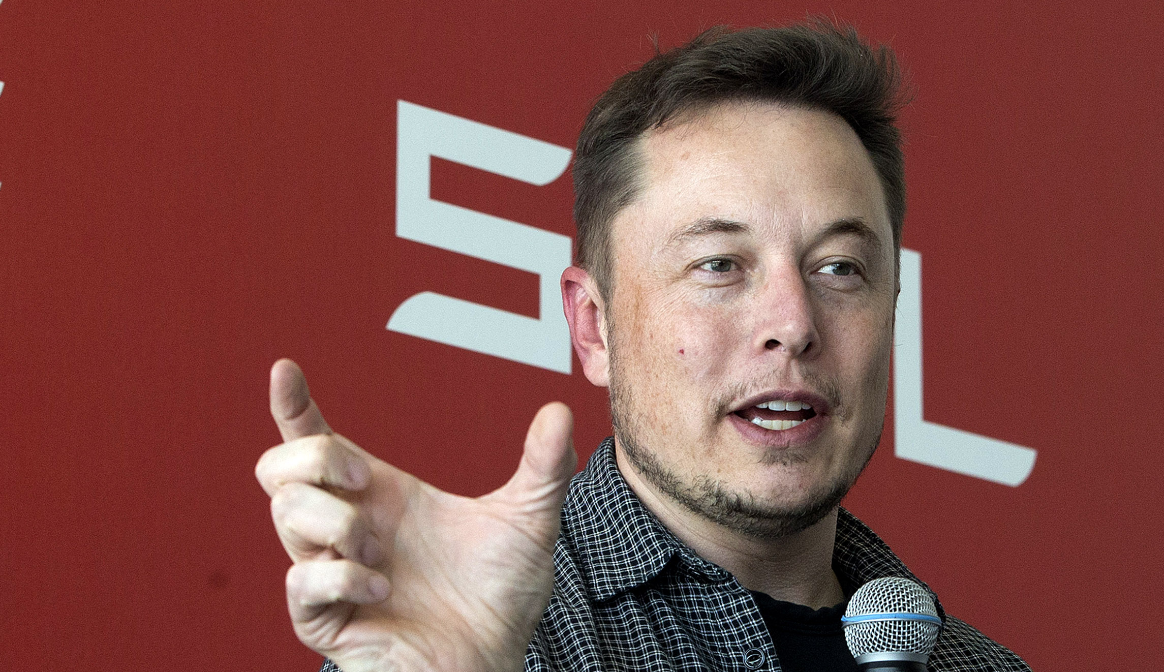 Tesla Motors Inc., CEO Elon Musk talks to the media.