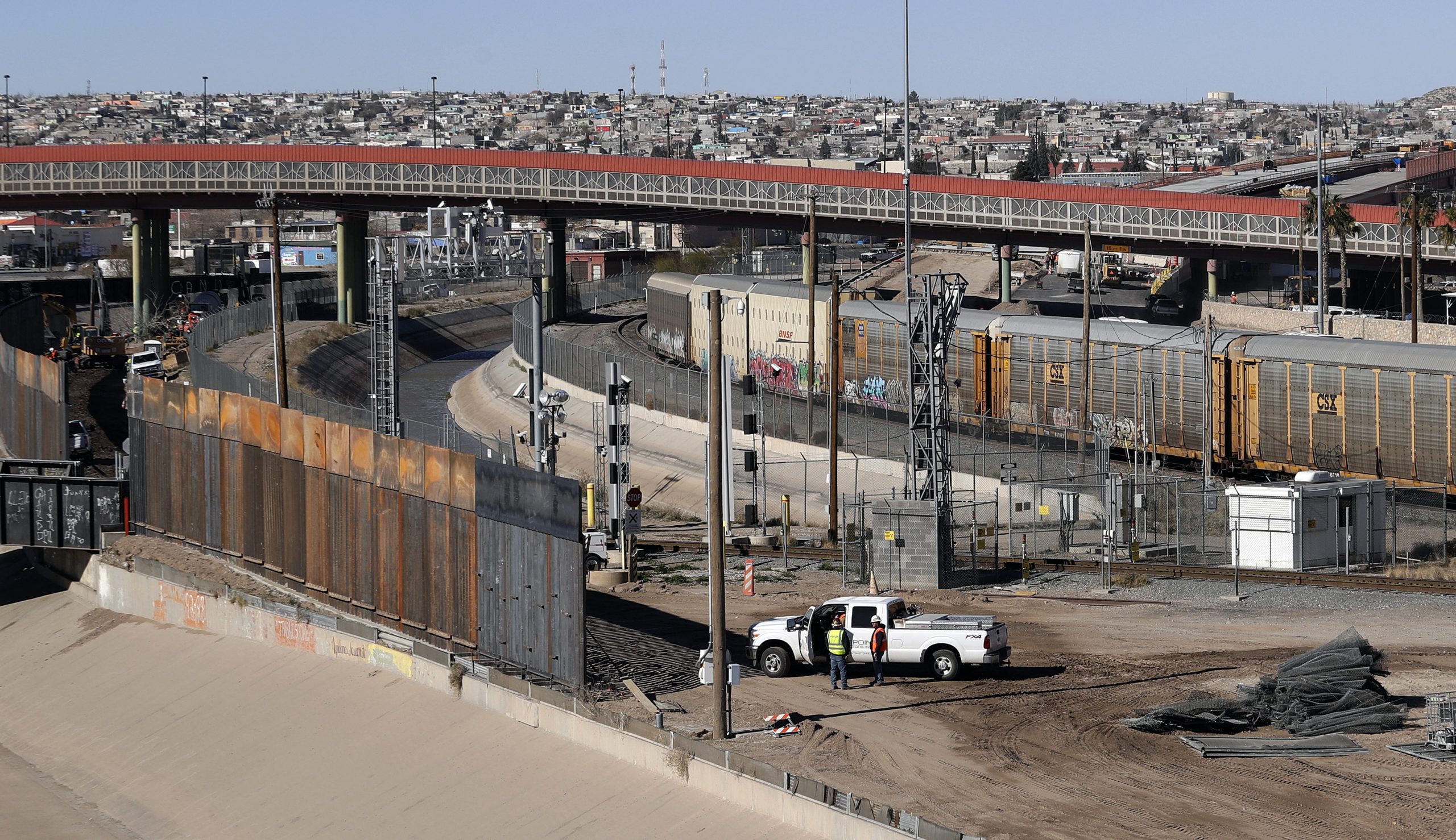 In this Tuesday, Jan. 22, 2019, photo, a new barrier is built along the Texas-Mexico border near downtown El Paso.