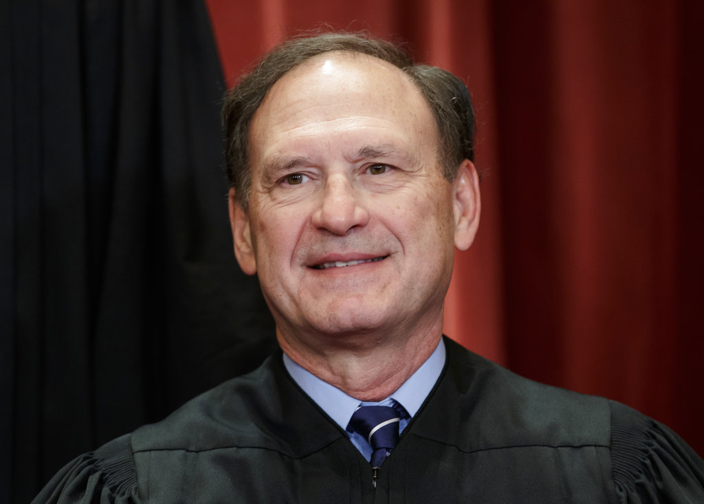 Associate Justice Samuel Alito Jr., nominated by President George W. Bush, sits with fellow Supreme Court justices for a group portrait at the Supreme Court Building in Washington, Friday, Nov. 30, 2018. 