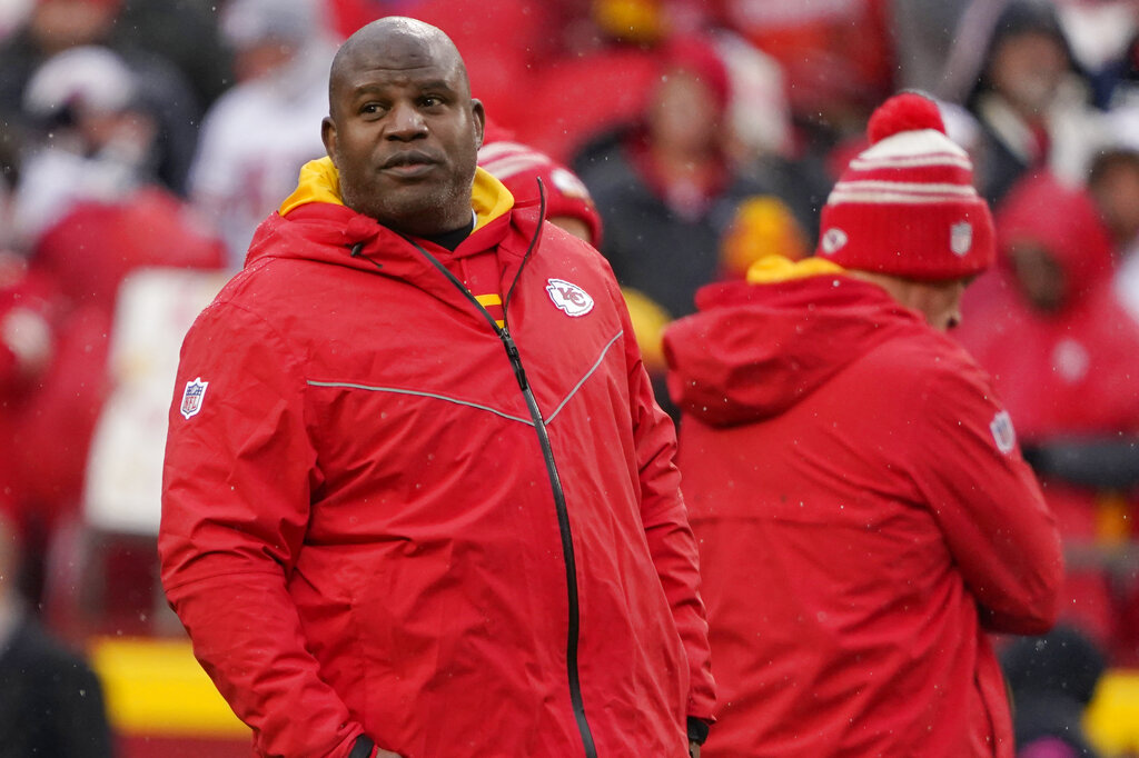 Kansas City Chiefs offensive coach Eric Bieniemy watches warms up prior prior to an NFL Divisional Playoff football game against the Jacksonville Jaguars Saturday, Jan. 21, 2023, in Kansas City, Mo.