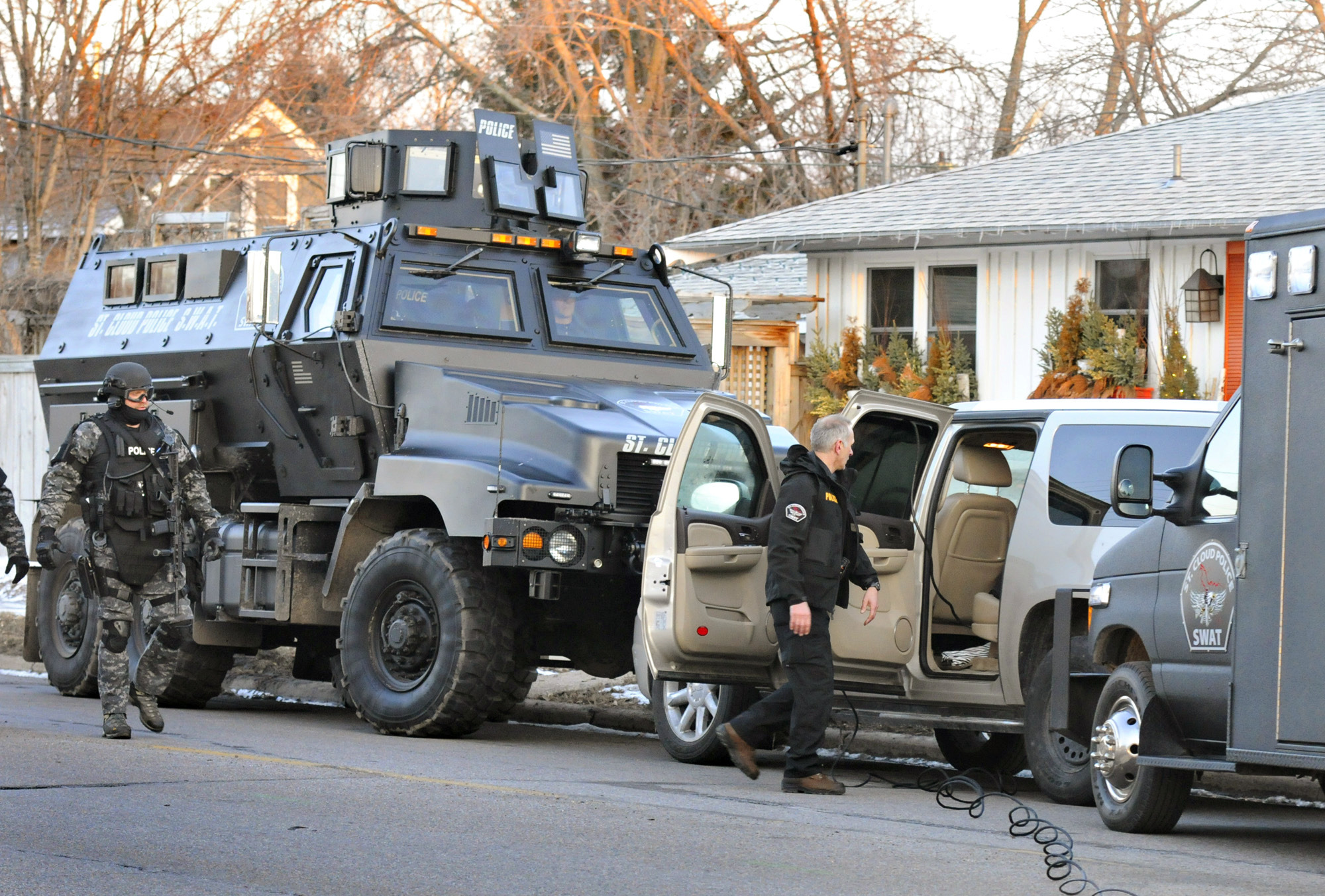 The images coming out of Ferguson, Mo., recently -- body-armored, camo-clad "peace officers" with sniper rifles and mine-resistant ambush-protected vehicles -- have a lot of Americans wondering whether that has become a meaningless distinction. (AP Photo)