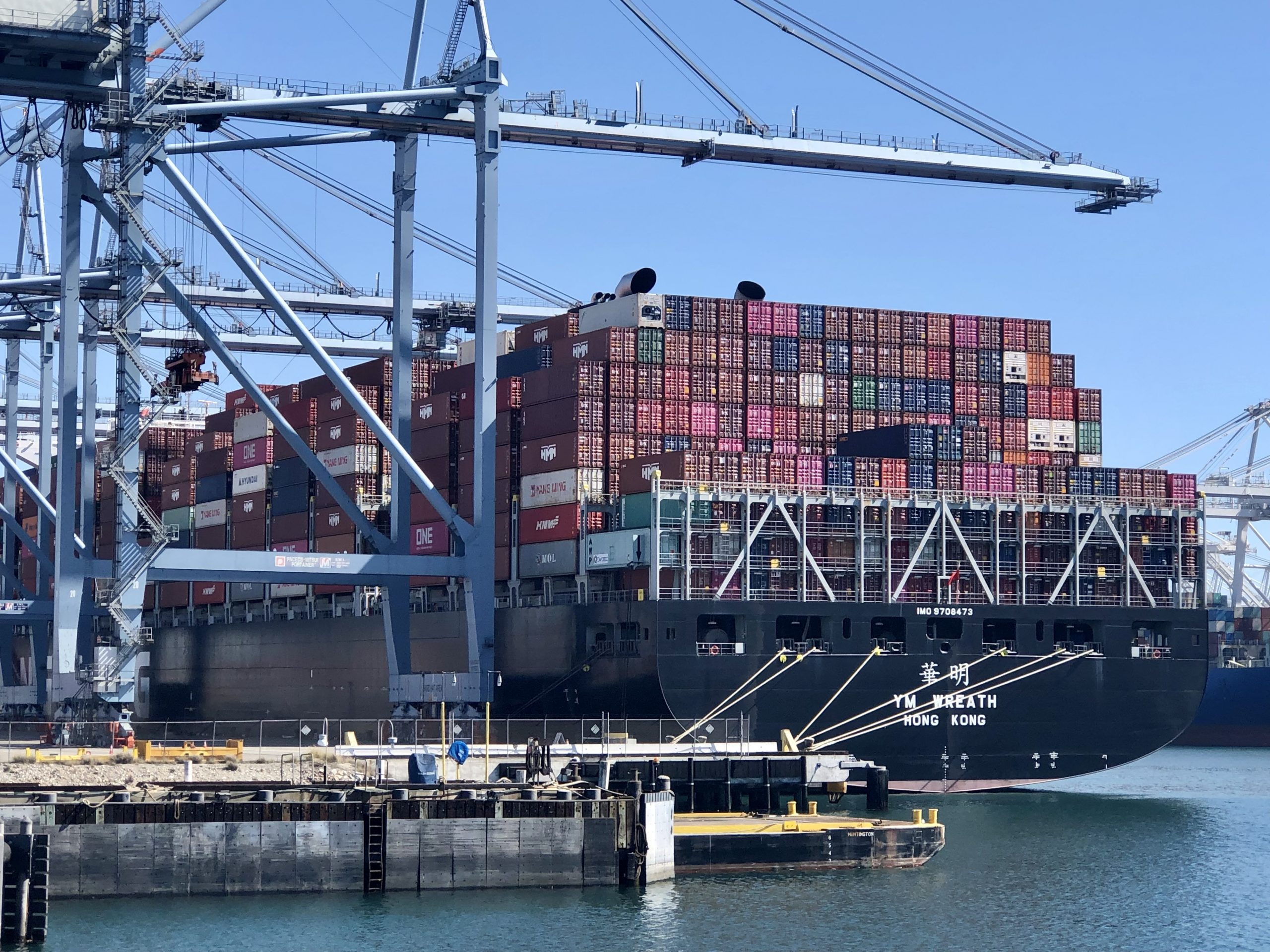 A Hong Kong cargo ship is unloaded in Long Beach harbor.jpg