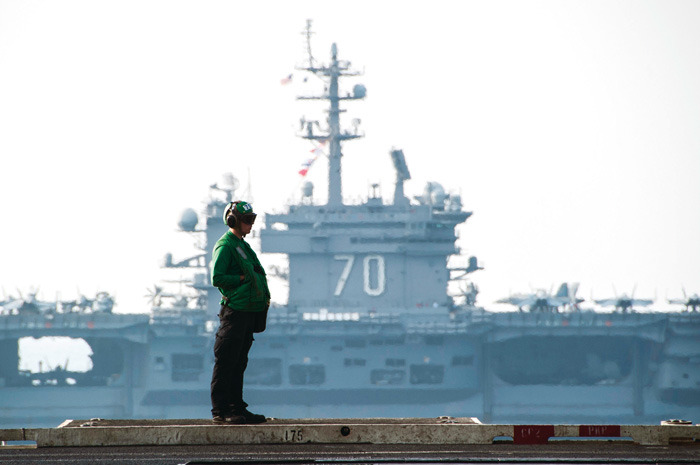 The aircraft carrier USS Carl Vinson, background, sails beside the aircraft carrier USS George H.W. Bush in the Persian Gulf. (AP/U.S. Navy, Brian Stephens)