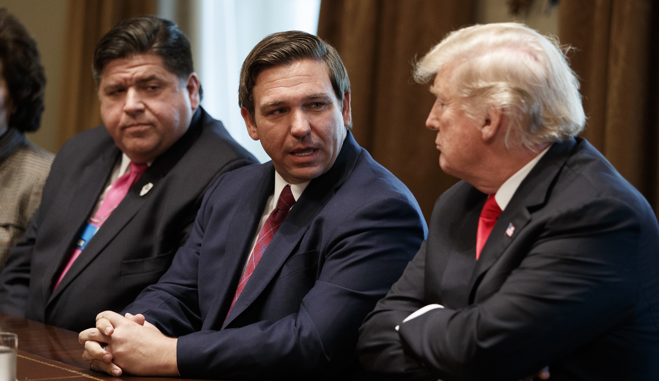 Governor-elect Ron DeSantis (R-FL, center) talks with President Donald Trump (right) during a meeting with newly elected governors in the Cabinet Room of the White House, Thursday, Dec. 13, 2018, in Washington