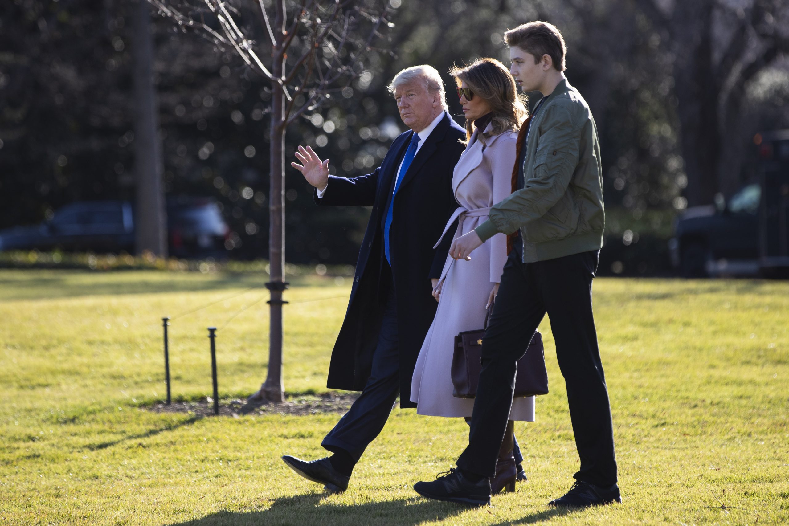 President Trump walks with first lady Melania Trump and Barron Trump to board Marine One on the South Lawn of the White House on Jan. 17, 2020, in Washington.