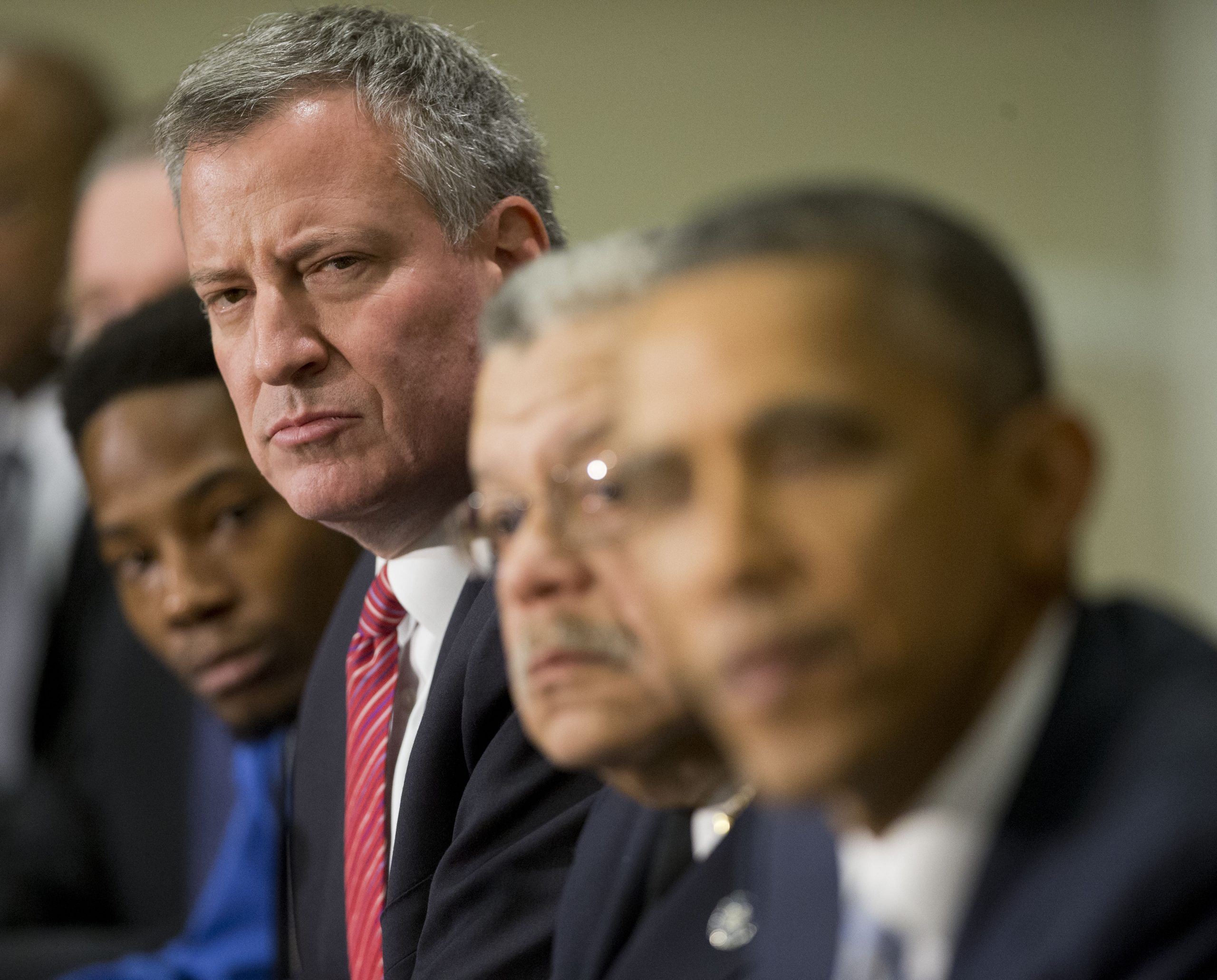 New York City Mayor Bill de Blasio, left, listens to President Barack Obama, right.