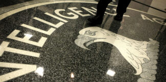 A man walks across the seal of the Central Intelligence Agency at the lobby of the Original Headquarters Building at the CIA headquarters February 19, 2009 in McLean, Va. (Photo by Alex Wong/Getty images)