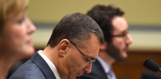 MIT economist Jonathan Gruber listens on Capitol Hill in Washington, Tuesday, Dec. 9, 2014, as he testified before the House Oversight Committee health care hearing. (AP Photo/Molly Riley)
