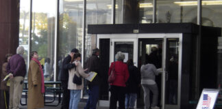 A line for early voting stretches out the door at the Zeidler Municipal Building in downtown Milwaukee. The Supreme Court will hear a Wisconsin case that could decide if the state's redistricting strategy violates the Constitution because it's too partisan. (AP Photo/Dinesh Ramde)