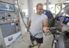 In this Wednesday, June 4, 2014 photo, Baltazar Rosado, of Hollywood, Fla., pumps gasoline into his car at a Chevron gasoline station in Pembroke Pines, Fla. The Labor Department reports on U.S. consumer prices in June on Tuesday, July 22, 2014. (AP Photo/Wilfredo Lee)