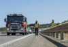 In this photo provided by the Department of Fire and Emergency Services, its members search for a radioactive capsule believed to have fallen off a truck.
