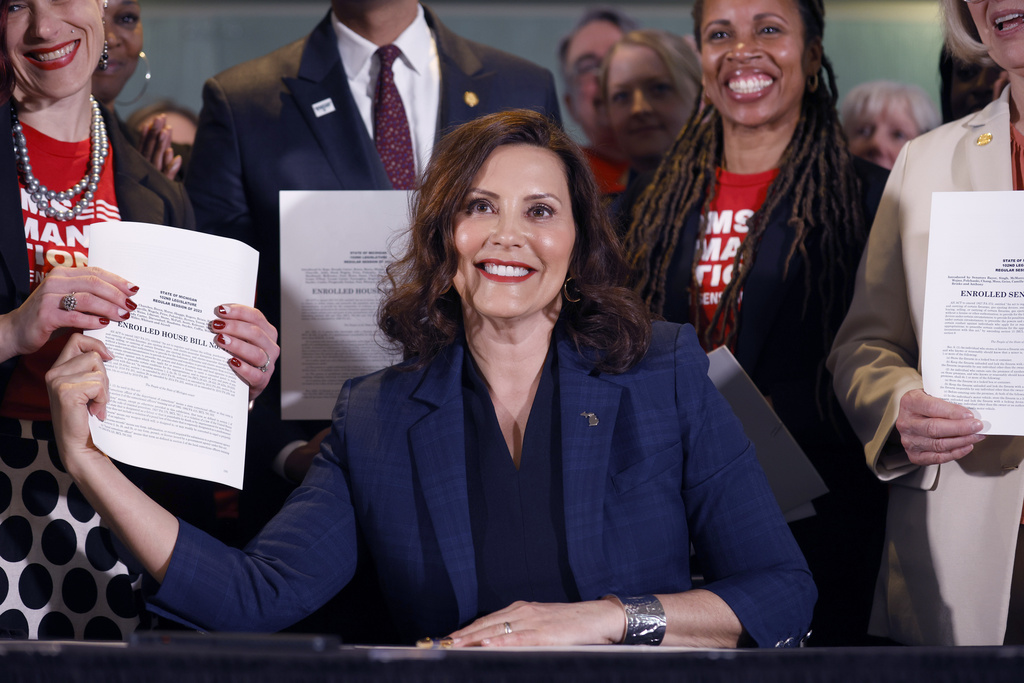 Michigan governor signs universal background check and firearm safe