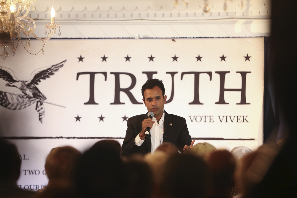 Vivek Ramaswamy’s ‘Truth’ sign falls on him during campaign event ...