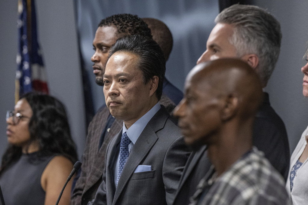 Sacramento County District Attorney Thien Ho stands with supporters and victims of alleged crimes by homeless residents on Tuesday, Sept. 19, 2023, at a news conference announcing that his office is suing the city of Sacramento.