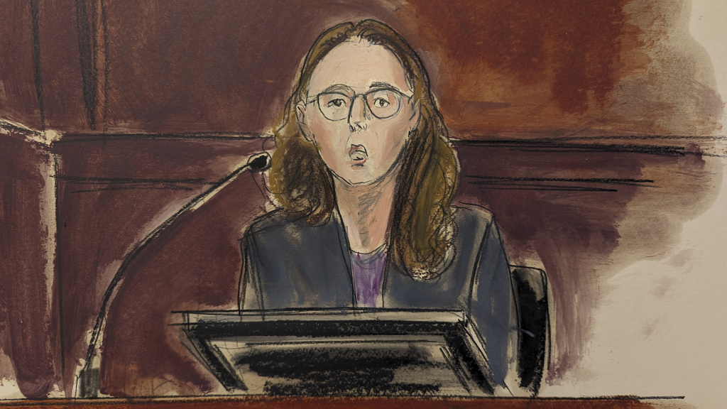 In this courtroom sketch,  Caroline Ellison testifies in Manhattan federal court, Tuesday, Oct. 10, 2023, in New York. 