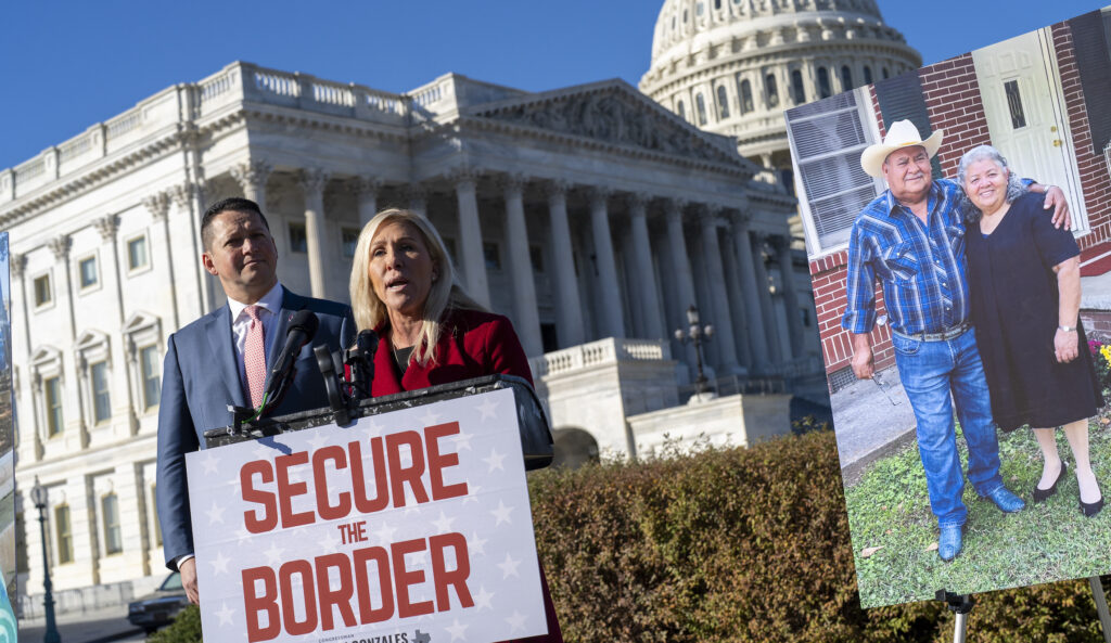 Rep. Tony Gonzales (R-TX) left, and Rep. Marjorie Taylor Greene (R-GA) hold a news conference on border security after the deaths of a Georgia couple, Jose Lerma, 67, and Isabel Lerma, 65, near Batesville, Texas, who were killed in a high-speed chase involving migrant smugglers, at the Capitol in Washington, Tuesday, Nov. 14, 2023.