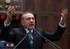 FILE - In this Tuesday Jan. 14, 2014 file photo, Turkey's Prime Minister Recep Tayyip Erdogan addresses his supporters at the parliament in Ankara, Turkey. An opposition party leader on Tuesday Feb. 25, 2014, called on Turkey's prosecutors to launch an investigation into Prime Minister Recep Tayyip Erdogan for alleged corruption, a day after the disclosure of audio recordings purportedly of him ordering his son to dispose of vast amounts of cash amid a graft probe. (AP Photo, File)