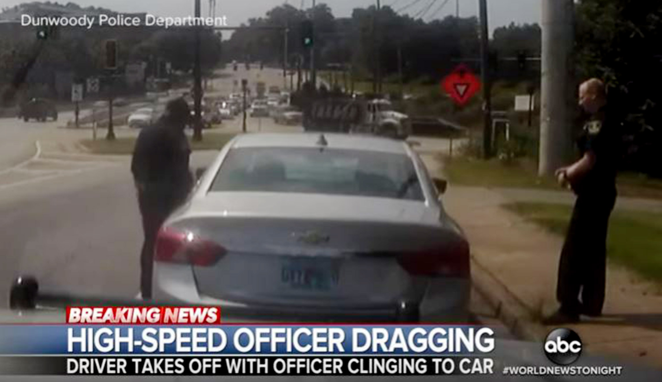 WATCH: Police Officer Dragged Onto Freeway As He Dangles From Suspect’s ...