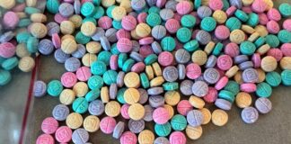 The image shows fentanyl pills in multiple colors, which the DEA says is an intentional move by the drug cartels to make them "look like candy."