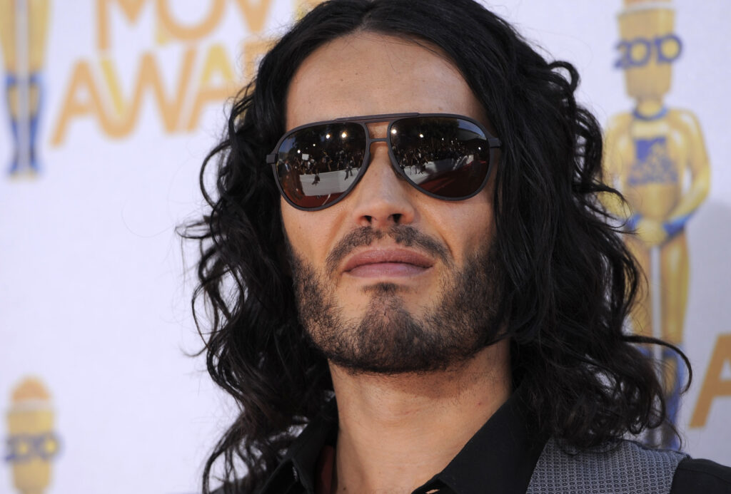Russell Brand faces backlash for displaying tarot cards in post-baptism video