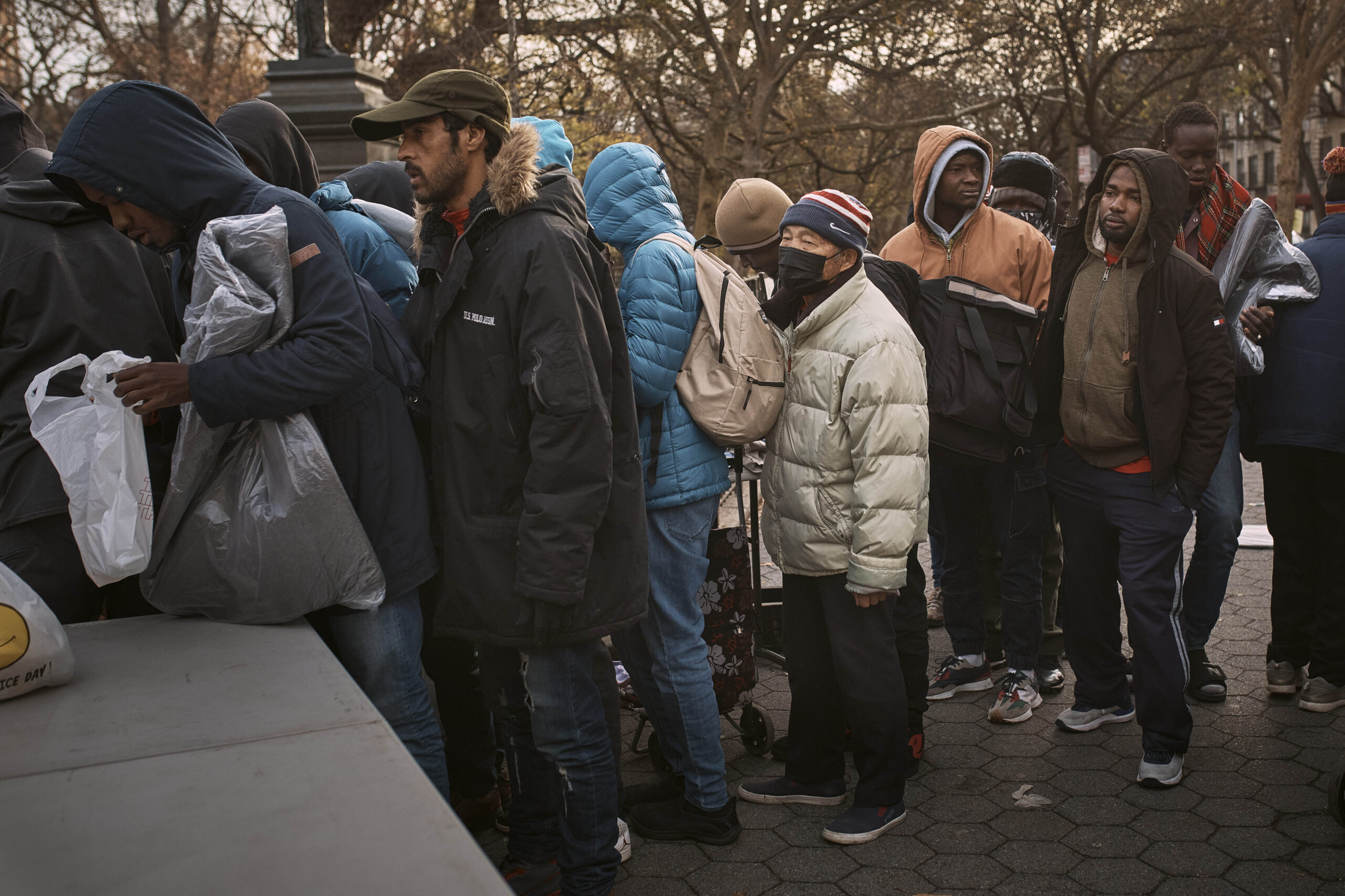 NextImg:NYC migrants get heated as their vehicles are towed from disputed shelter