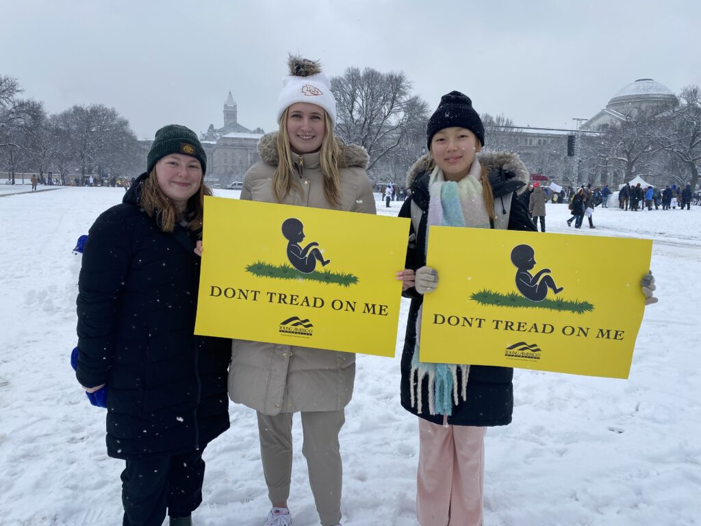 (L-R) Dierdra Sullivan, Anna Phillips, and Youngji Cho of South Korea attend the 51st annual March for Life on January 19, 2024. (Washington Examiner; Breccan F. Thies).