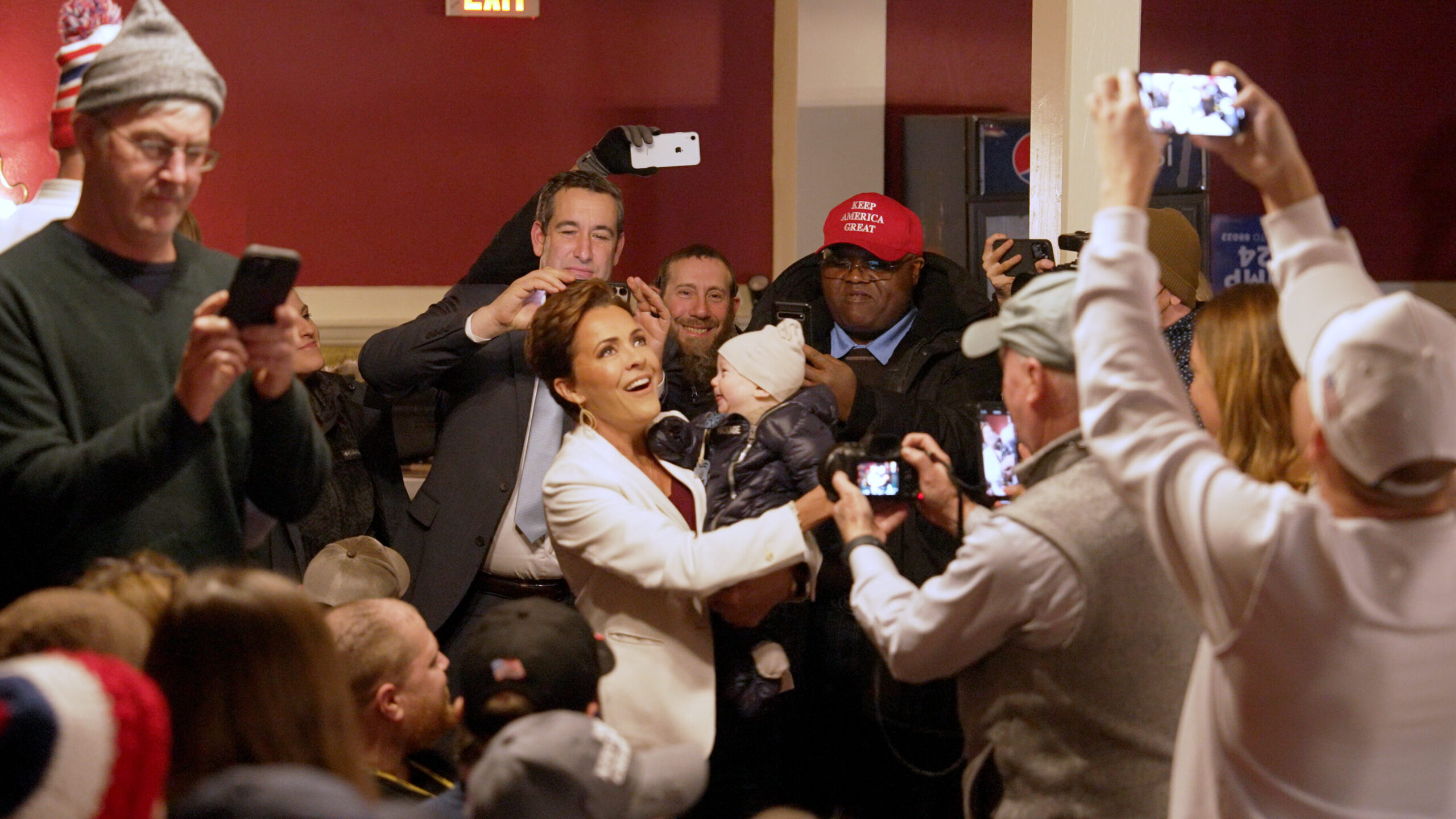 Kari Lake kissing babies at Trump rally in Rochester, NH