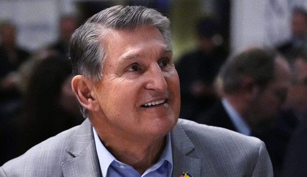 Sen. Joe Manchin (D-WV) smiles while being introduced during an event on Friday, Jan. 12, 2024, in Manchester, N.H. (AP Photo/Charles Krupa)