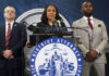 FILE - Fulton County District Attorney Fani Willis, center, speaks along side special prosecutor Nathan Wade, right, during a news conference at the Fulton County Government Center, Monday, Aug. 14, 2023, in Atlanta. Willis acknowledged in a court filing on Friday, Feb. 2, 2024, having a “personal relationship” with Wade, a special prosecutor she hired for the Georgia election interference case against former President Donald Trump, but argued there are no grounds to dismiss the case or to remove her from the prosecution. (AP Photo/John Bazemore, File)
