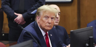 Former President Donald Trump appears during a court hearing at Manhattan criminal court, Thursday, Feb. 15, 2024, in New York. A New York judge says Trump's hush-money trial will go ahead as scheduled with jury selection starting on March 25. (Brendan McDermid/Pool Photo via AP)