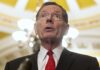 Sen. John Barrasso (R-WY) speaks after a policy luncheon on Capitol Hill, Tuesday, Feb. 27, 2024, in Washington. (AP Photo/Mark Schiefelbein)