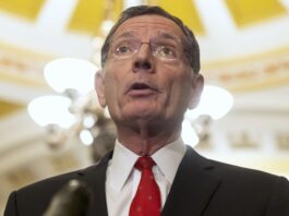 Sen. John Barrasso (R-WY) speaks after a policy luncheon on Capitol Hill, Tuesday, Feb. 27, 2024, in Washington. (AP Photo/Mark Schiefelbein)