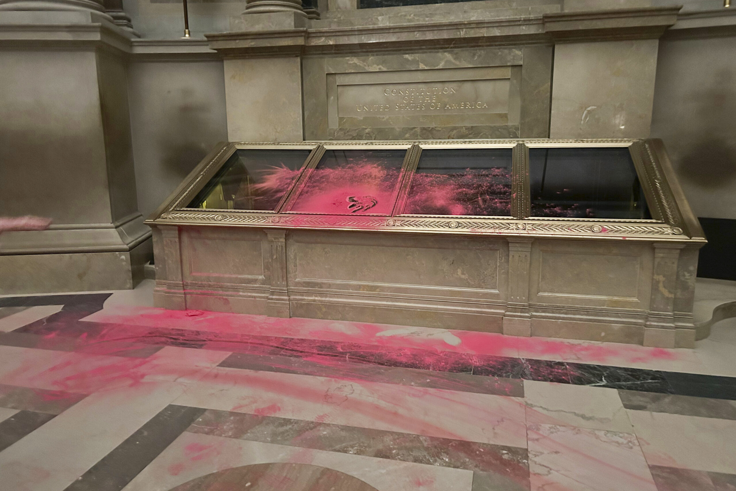 NextImg:Protesters face $50,000 fine for red powder attack on the Constitution