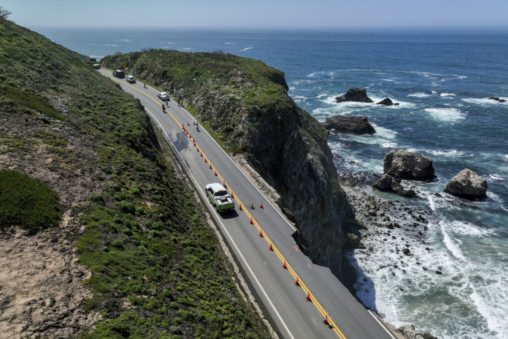 Drivers move slowly along a single lane following the collapse of a section of California’s famous Highway 1